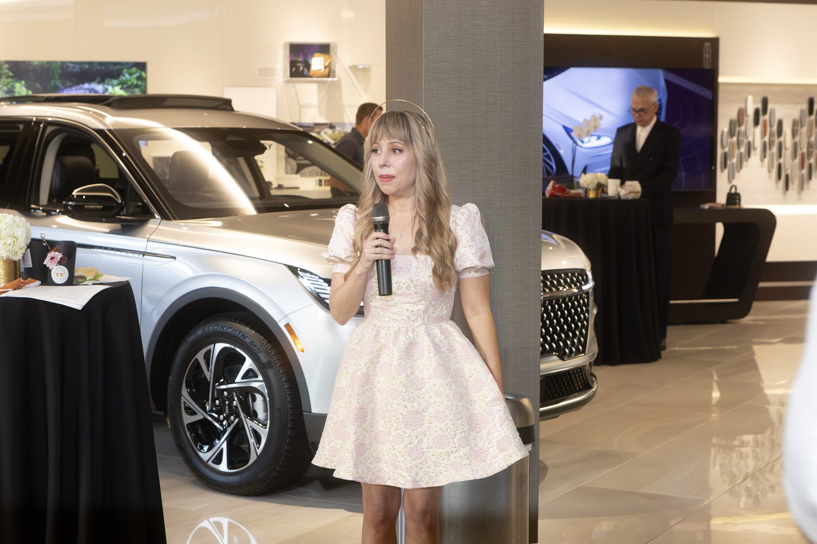 Speaker with a microphone inside the Lincoln Experience Center