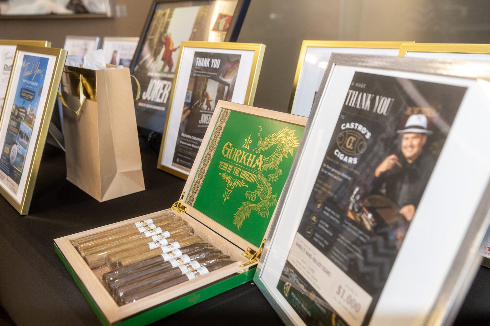Silent auction items displayed on a table